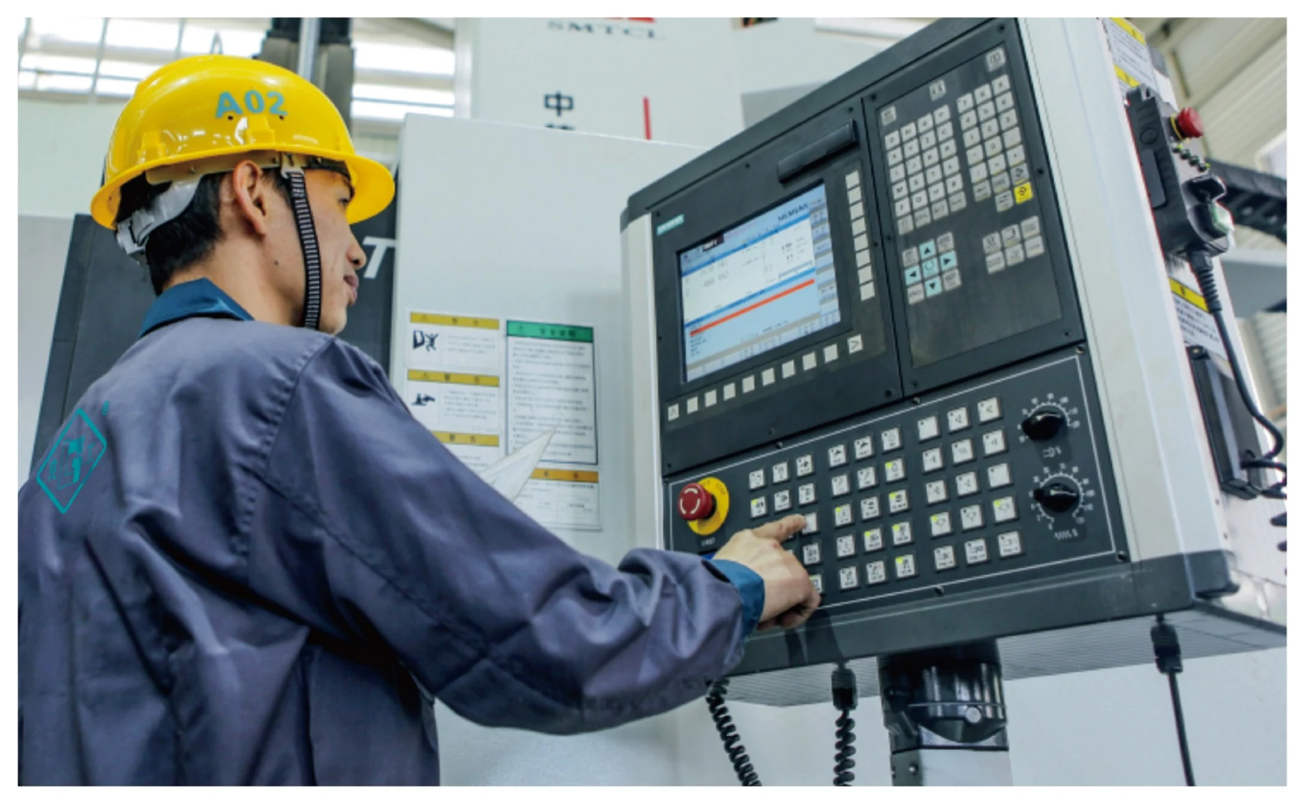 Operator working at CNC machining equipment in the Lianggong workshop